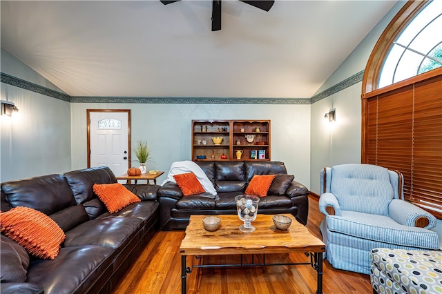 living room with lofted ceiling, ceiling fan, and hardwood / wood-style floors