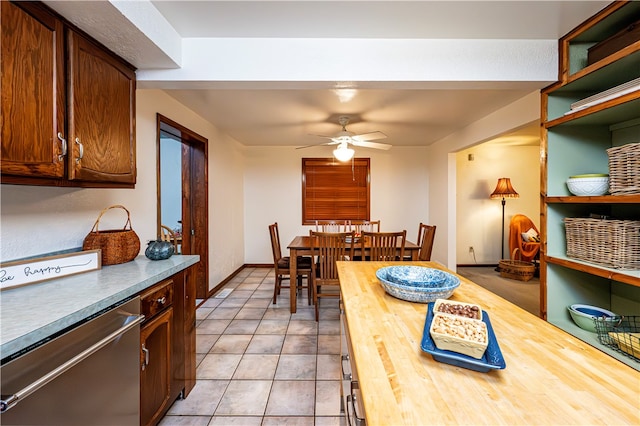 tiled dining room with ceiling fan