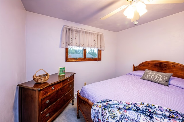 bedroom featuring ceiling fan and light colored carpet