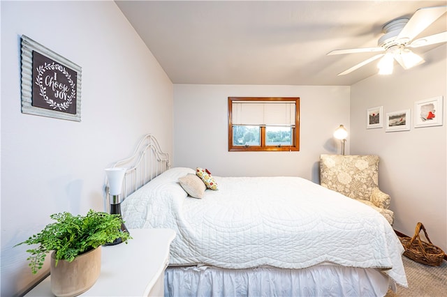 bedroom with ceiling fan and carpet floors