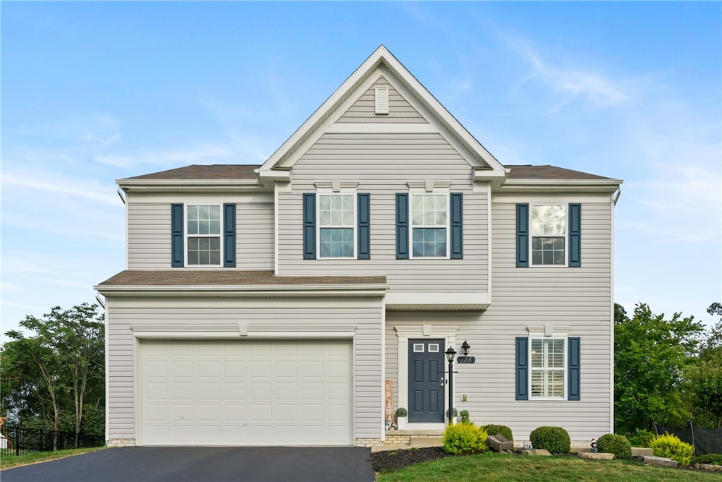 view of front of property featuring a garage