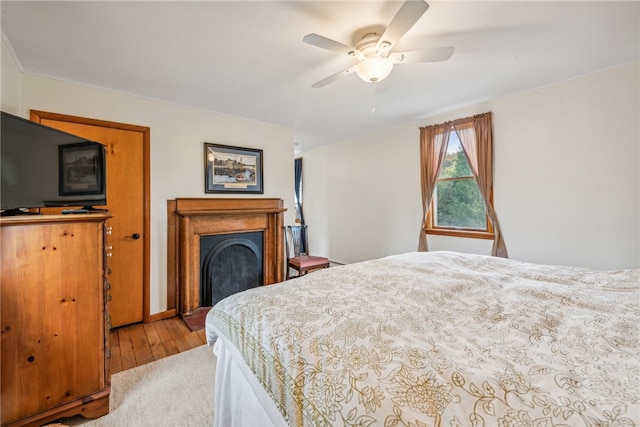 bedroom featuring light hardwood / wood-style floors and ceiling fan