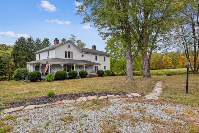 view of front facade featuring a porch and a front yard