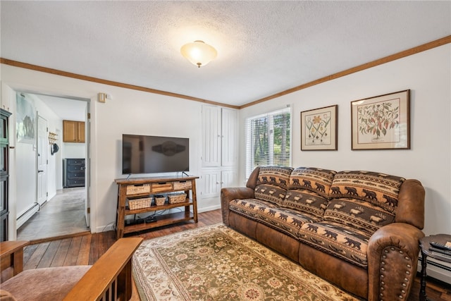 living room with ornamental molding, a textured ceiling, dark hardwood / wood-style flooring, and a baseboard heating unit