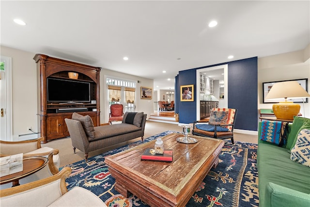 carpeted living room featuring a baseboard radiator