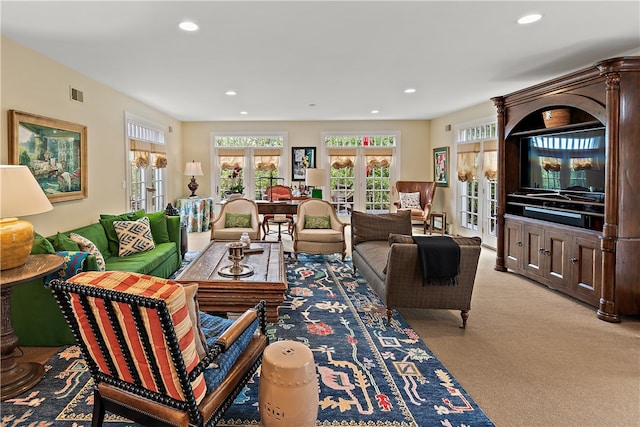 carpeted living room with french doors