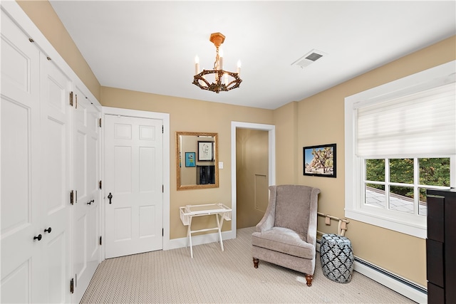 sitting room featuring light colored carpet, an inviting chandelier, and a baseboard heating unit