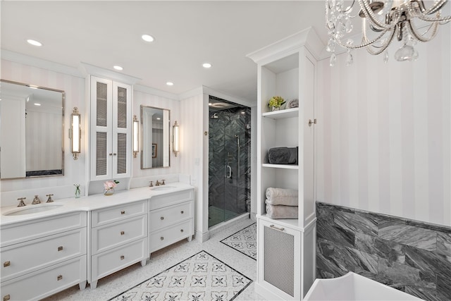 bathroom with a notable chandelier, built in shelves, walk in shower, crown molding, and vanity