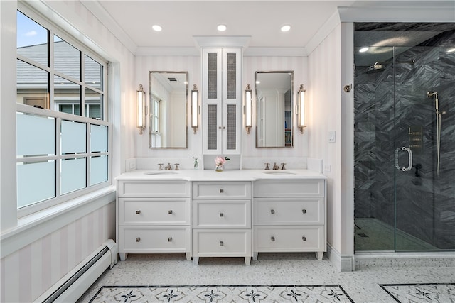 bathroom with vanity, a baseboard radiator, ornamental molding, and an enclosed shower