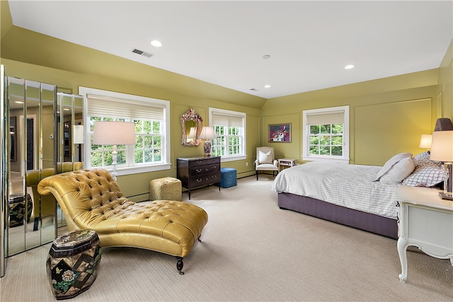 bedroom featuring multiple windows, light colored carpet, and a baseboard radiator