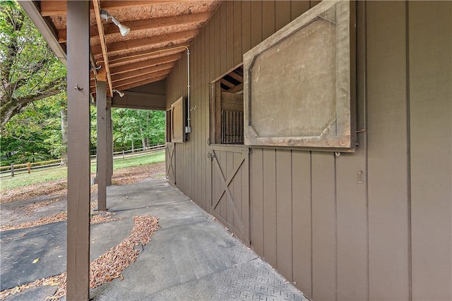 view of patio featuring an outbuilding