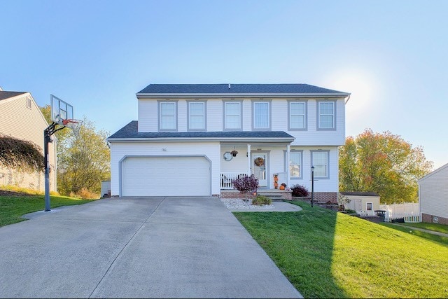 view of front property featuring a front yard and a garage