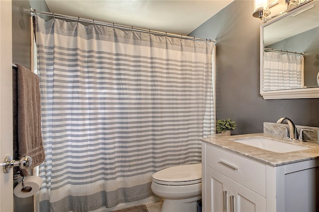 bathroom with tile patterned flooring, vanity, toilet, and a shower with shower curtain