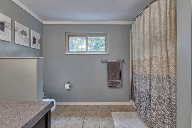 bathroom with tile patterned flooring, walk in shower, and vanity