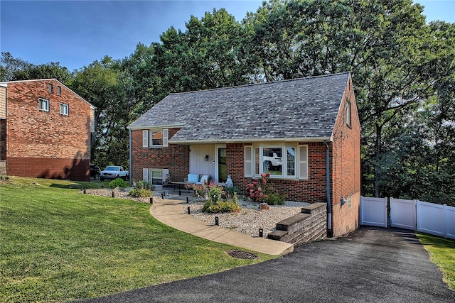 split level home with a front yard