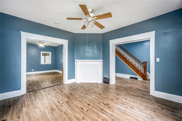 spare room with wood-type flooring and ceiling fan