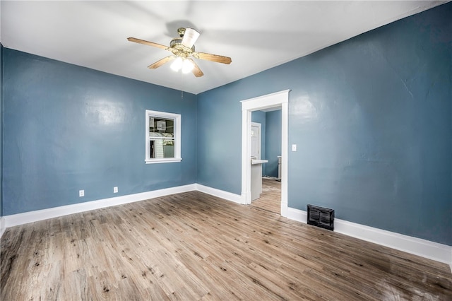 unfurnished room featuring ceiling fan and hardwood / wood-style flooring