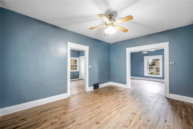 spare room featuring light hardwood / wood-style floors and ceiling fan