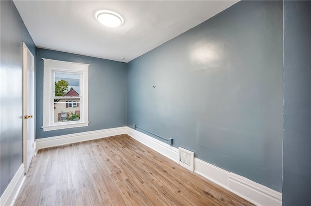 unfurnished room featuring light hardwood / wood-style floors