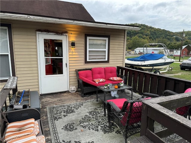 wooden deck featuring an outdoor hangout area