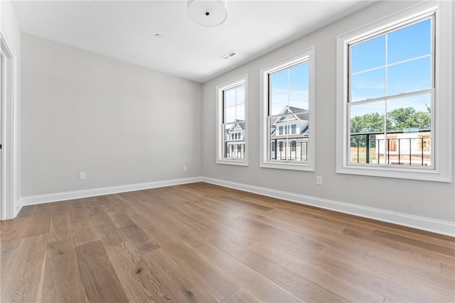 unfurnished room featuring light wood-type flooring