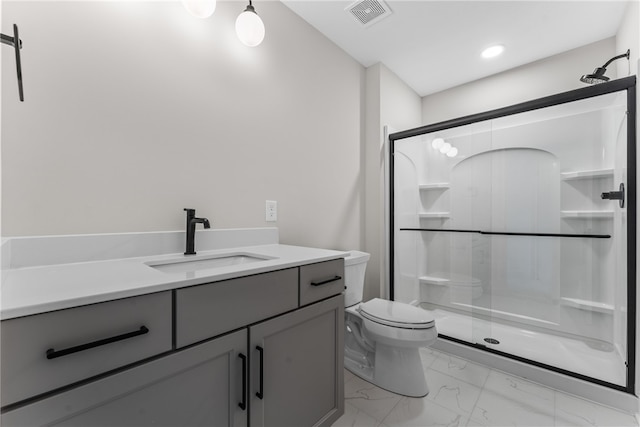 bathroom with an enclosed shower, vanity, and toilet