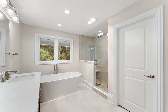 bathroom featuring vanity and separate shower and tub