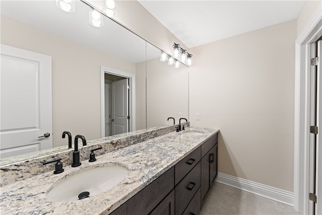 bathroom with tile patterned floors and vanity