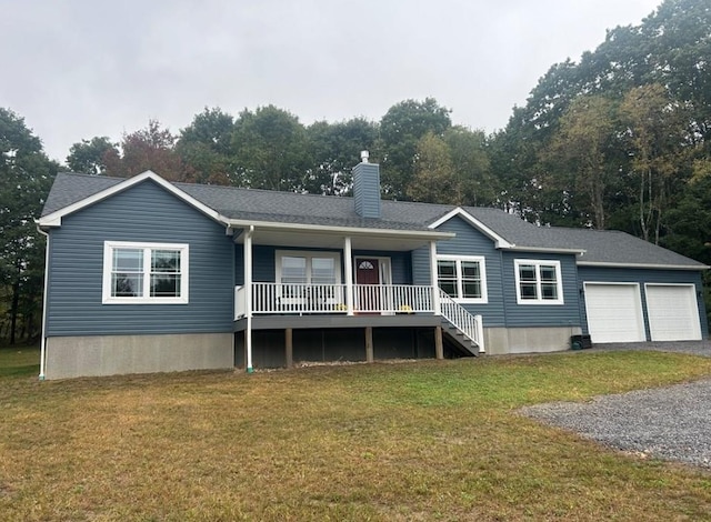 view of front of house with a garage and a front lawn