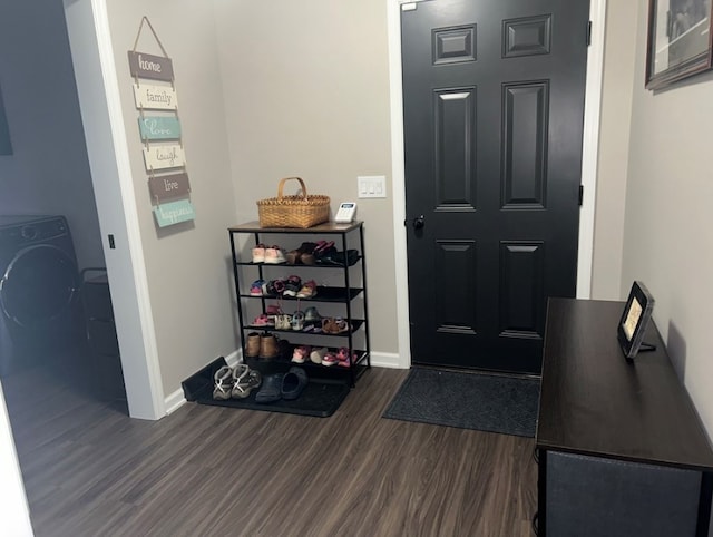 foyer with dark hardwood / wood-style floors and washer / dryer