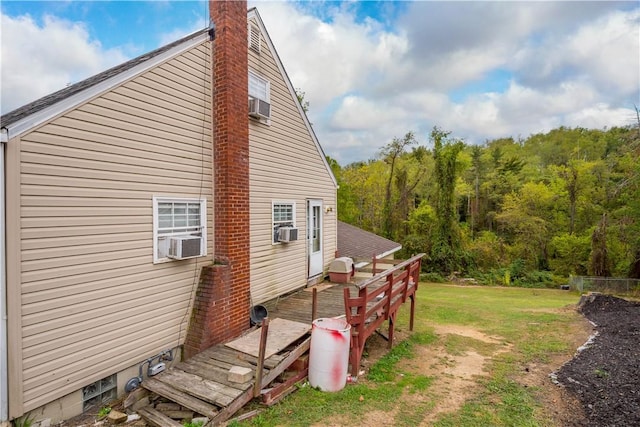 265 Johnston Rd, Bentleyville, PA 15314 - view of property exterior featuring a deck, cooling unit, a lawn, and a chimney