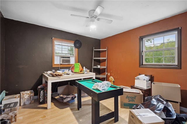 office with ceiling fan and light hardwood / wood-style flooring