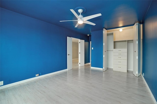 unfurnished bedroom with ceiling fan, a closet, and light hardwood / wood-style flooring