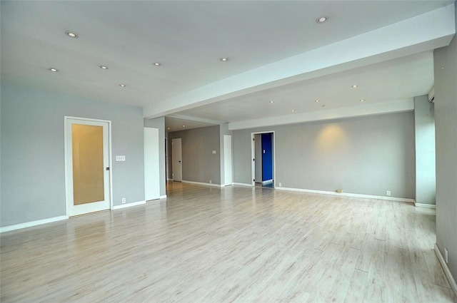 spare room with light hardwood / wood-style flooring