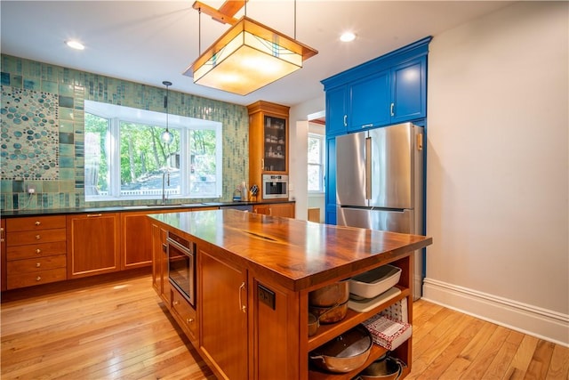 1487 Beaver Rd, Sewickley, PA 15143 - kitchen with open shelves, a sink, light wood-type flooring, butcher block countertops, and glass insert cabinets