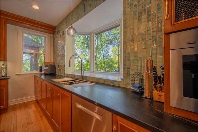 1487 Beaver Rd, Sewickley, PA 15143 - kitchen with dark countertops, baseboards, a sink, and plenty of natural light
