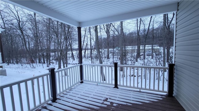 view of snow covered deck