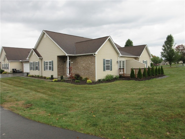 view of home's exterior featuring a yard