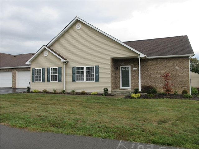 single story home featuring a front yard and a garage