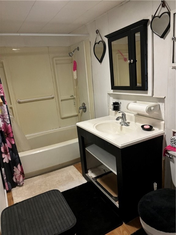 full bathroom with shower / tub combo with curtain, vanity, and toilet