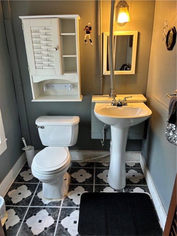 bathroom with tile patterned flooring and toilet