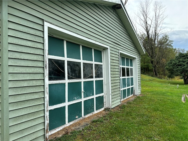 view of side of home featuring a lawn