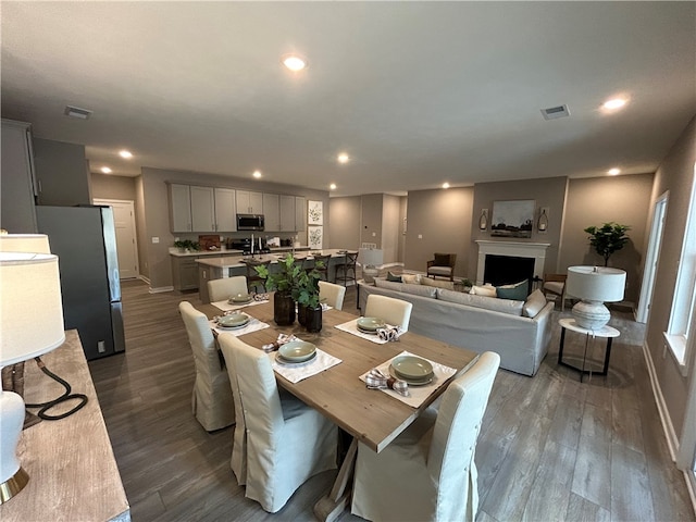 dining space with dark hardwood / wood-style floors