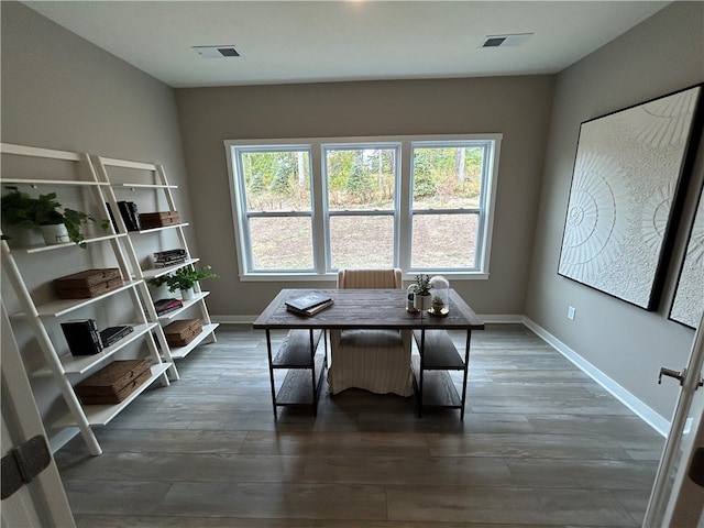 interior space with a healthy amount of sunlight and dark hardwood / wood-style floors