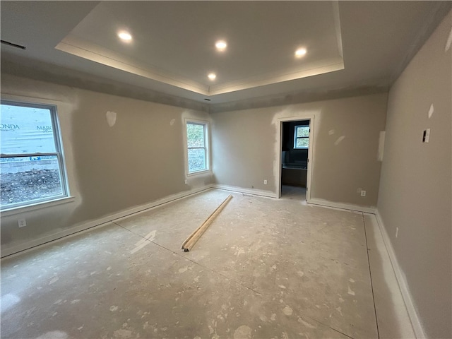 empty room featuring a tray ceiling