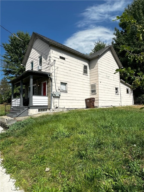 view of home's exterior featuring a lawn