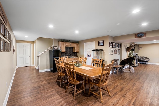 dining area featuring dark hardwood / wood-style flooring