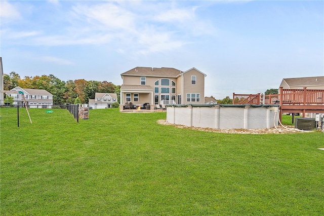 view of yard featuring a swimming pool side deck