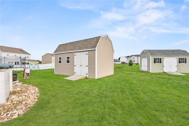 view of outbuilding with a yard