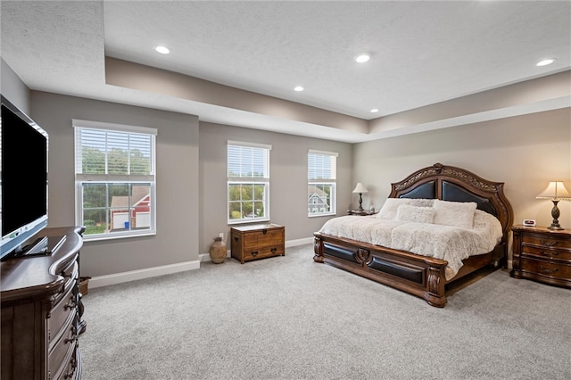 carpeted bedroom with a textured ceiling